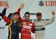 Fernando Alonso (centre) on the podium with Kimi Raikkonen (left) and Lewis Hamilton in Shanghai, April 14, 2013